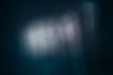 Smeared white light reflection. Teal blue abstract art background. Blur lens flare.
