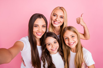 Self-portrait of four nice attractive lovely charming cute cheerful cheery long hair girls showing thumbup ad advert decision choose choice motherhood isolated over pink pastel background