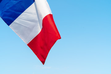 Flag of France waving in the wind in the sky