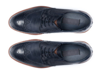 Classic male leather shoes isolated on a white, top view.