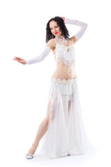 Professional shooting of a young beautiful girl in the costume of an oriental dancer