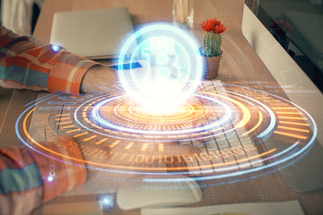 Blockchain theme hud with man working on computer on background. Concept of crypto chain. Double...