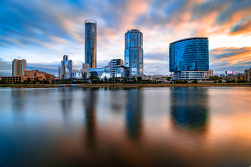 Fototapeta na wymiar Beautiful cityscape Yekaterinburg at sunset with blurred blue and purple clouds