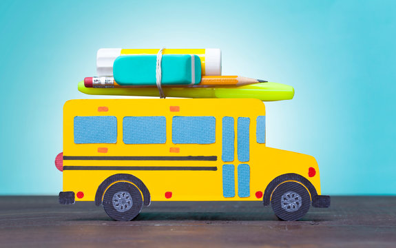 Back to school concept with yellow school bus.