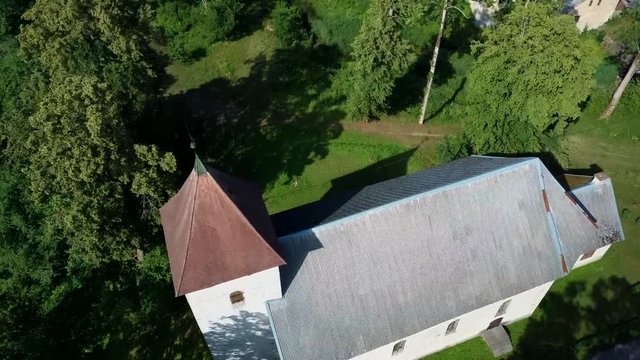 Aerial Dron Shot of the Cirava Lutheran Church Aizpute  Latvia, Sunny Summer Day. Flaying Above the  Church and Manor Castle.