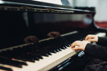 close up little girl playing piano © cherryandbees