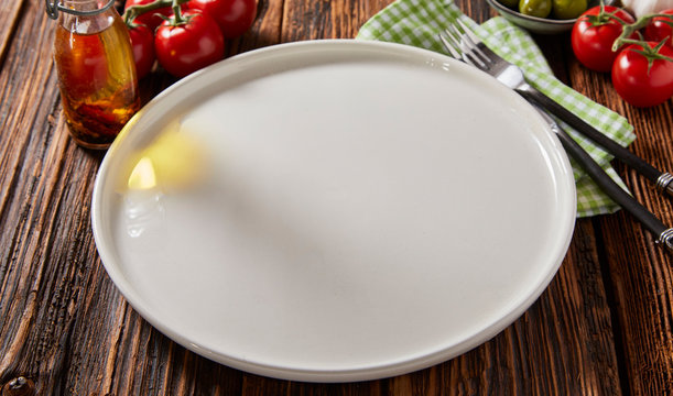 Clean empty white ceramic pizza plate