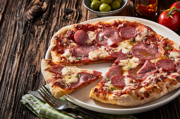Sliced portion of freshly made pepperoni pizza