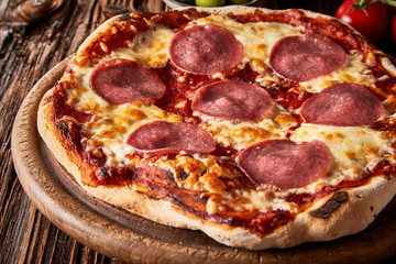 Crusty Italian pepperoni or salami pizza