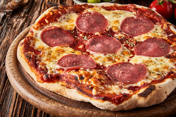 Close up on a flame-grilled crusty Italian pizza