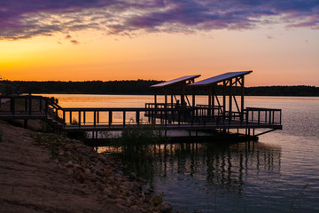 Beautiful view of the evening pier at sunset