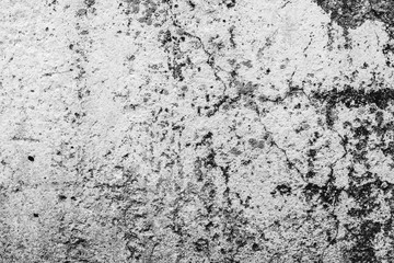 Texture of a concrete wall with cracks and scratches which can be used as a background