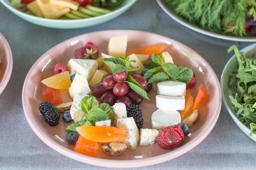 fresh salad of vegetables, fruits and berries. Healthy food