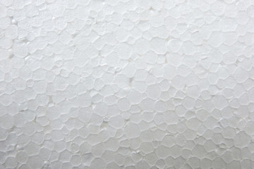 Obraz na płótnie Canvas Styrofoam clouseup on darck background. Foam plastic texture.