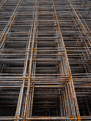 Building material for strengthening concrete structures. Rusty construction mesh