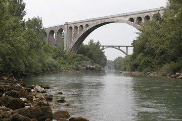 Fototapeta na wymiar Solkan stone railway bridge in Slovenia over the river Soсa