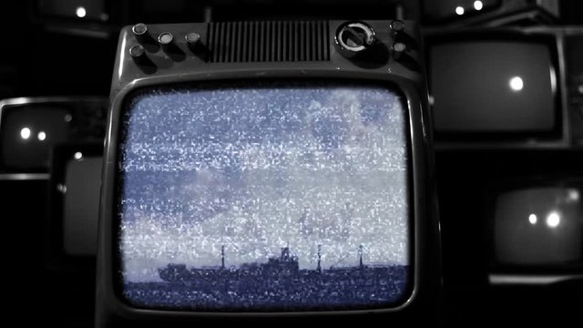 Retro TV Captures a Huge Atomic Bomb Explosion Underwater with its Effects on Ship. Black and White Tone.  Editorial use only. Contains public domain U.S. Army material displayed on screen.