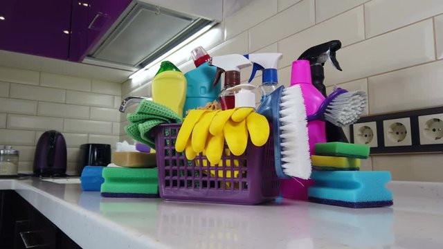 different products and items for cleaning on the floor in the kitchen. Concept cleaning