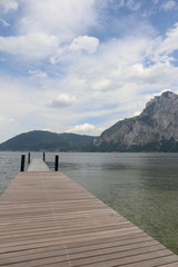 landscape lake, mountains and wooden bridge