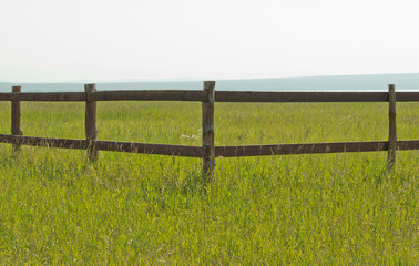 wooden fence in the field in daylight