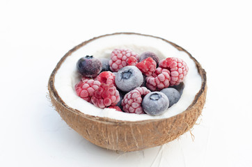 The composition of frozen berries and pieces of broken coconut.
