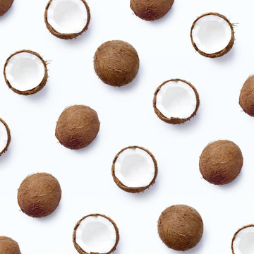 Coconut and its halves pattern. Coconut texture on a white background. From top view. Flat lay template