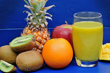 Fresh glass of juice with fruit mix
