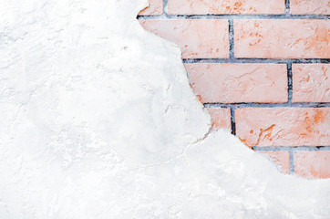 Background of gray wall with red brick elements.