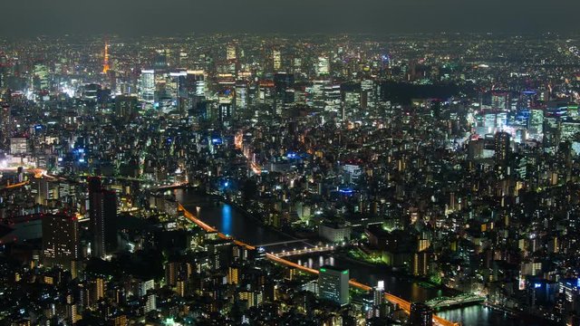 Timelapse of illuminated Tokyo cityscape at night, Japan