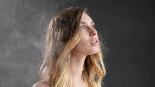 young girl posing with smoke