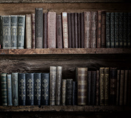 old books on wooden shelf.