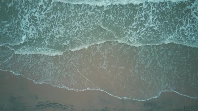 Aerial Dron Shot of the Baltic Sea Costline With Waves View From Above. Sea Waves Over a Sandy Beach. Top View of Sea Waves Foaming and Splashing, Big Waves From Above	