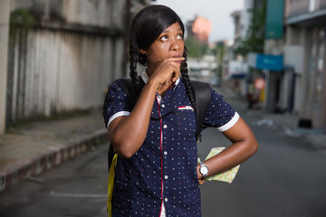 portrait of young female tourist with map.
