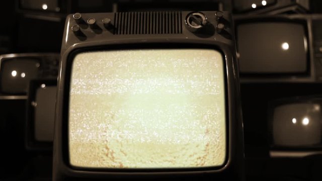 Atomic Bomb Testing On Retro Television Set. Aerial View of the Nuclear Explosion.  Sepia Tone. Editorial use only. Contains public domain U.S. Army material displayed on screen.