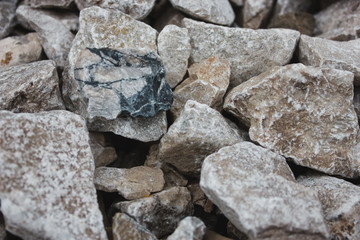 Fototapeta na wymiar stone nature wet dirt earth asphalt road texture pebble monolith granite flint rock boulder cobblestone abstraction background