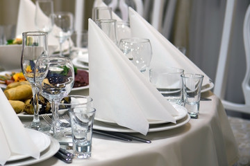 Table with food in the restaurant. Festive dishes at the festival.