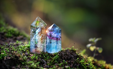 Beautiful minerals towers close up on mysterious natural background. fluorite quartz gemstones for Magic healing Crystal Ritual, Witchcraft. spiritual esoteric practice for soul relax. Reiki therapy. - obrazy, fototapety, plakaty