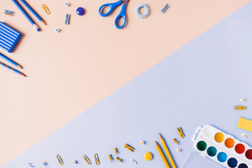 Two-tone background with scattered writing materials.