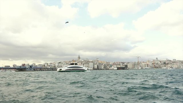 A wide plan of the Istanbul Embankment, a view of the Galata Tower and the Galata Bridge