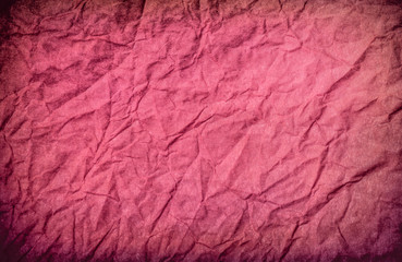 Texture of red crumpled paper. Vintage background