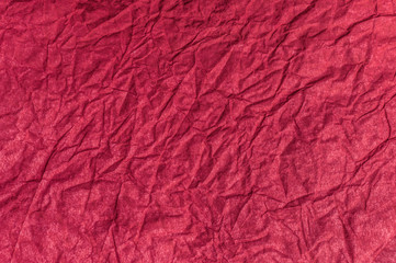 Texture of red crumpled paper. Vintage background