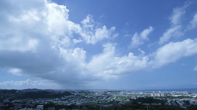 Timelapse of clouds moving above city, Kitanakagusuku, Okinawa, Japan