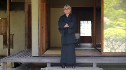 Mature man standing on porch, Hokkaido, Japan