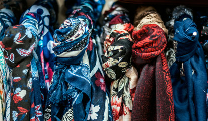 Fototapeta premium Scarves on hangers in a store
