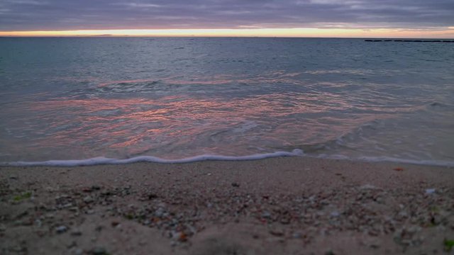 Beach and waves in sea at sunset, Ginowan, Okinawa Prefecture, Japan