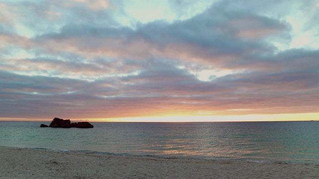 Beach and waves in sea at sunset, Ginowan, Okinawa Prefecture, Japan