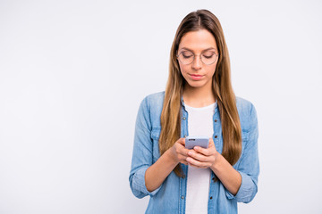 Close up photo of beautiful nice satisfied lady checking her telephone isolated grey background