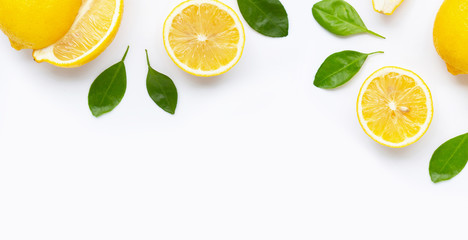 Fresh lemon and  slices  with leaves isolated on white.