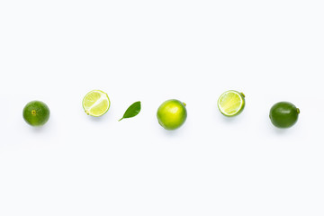 Limes with leaves isolated on white background.