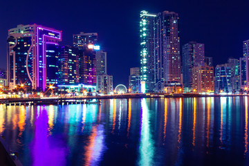 Obraz na płótnie Canvas Sharjah skyline at night, United Arab Emirates